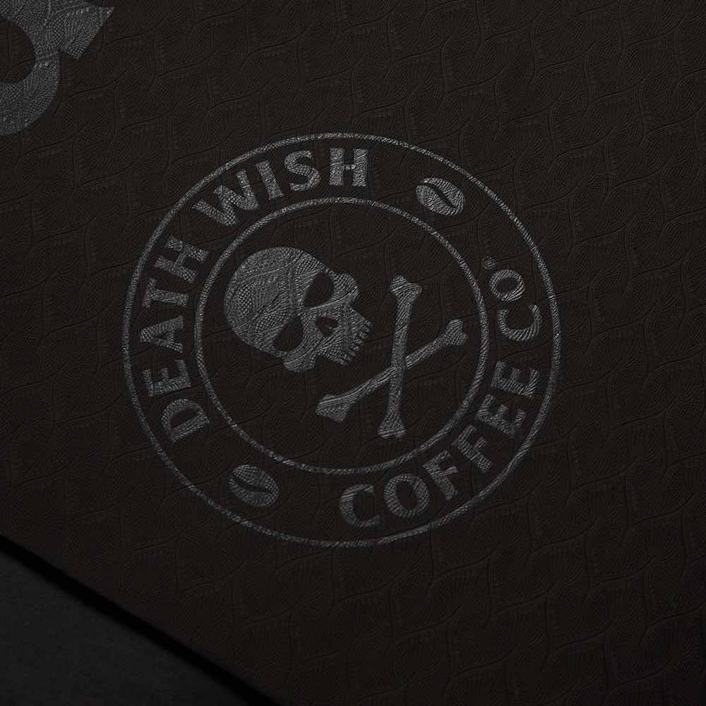 A detailed look at the logo on the Death Wish Coffee Stretch Don’t Snap Yoga Mat.
