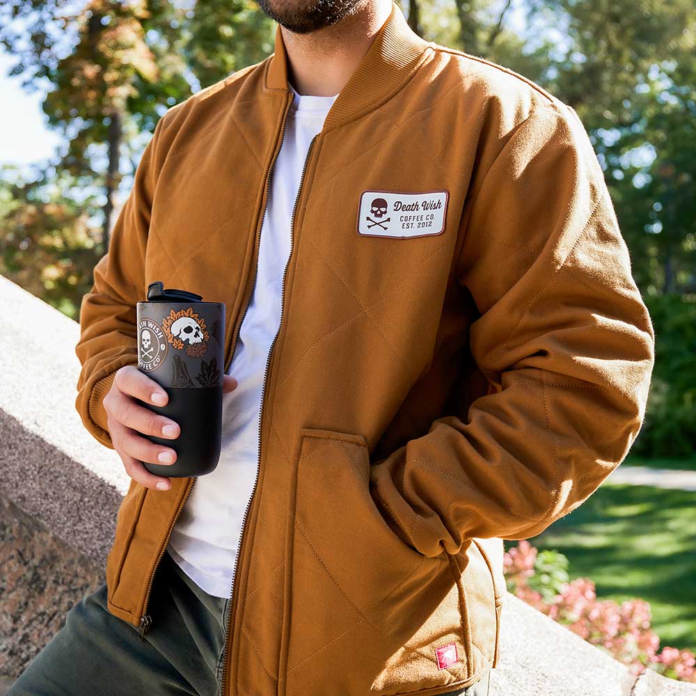 A model wearing the Death Wish Coffee Rough Cut Canvas Jacket.