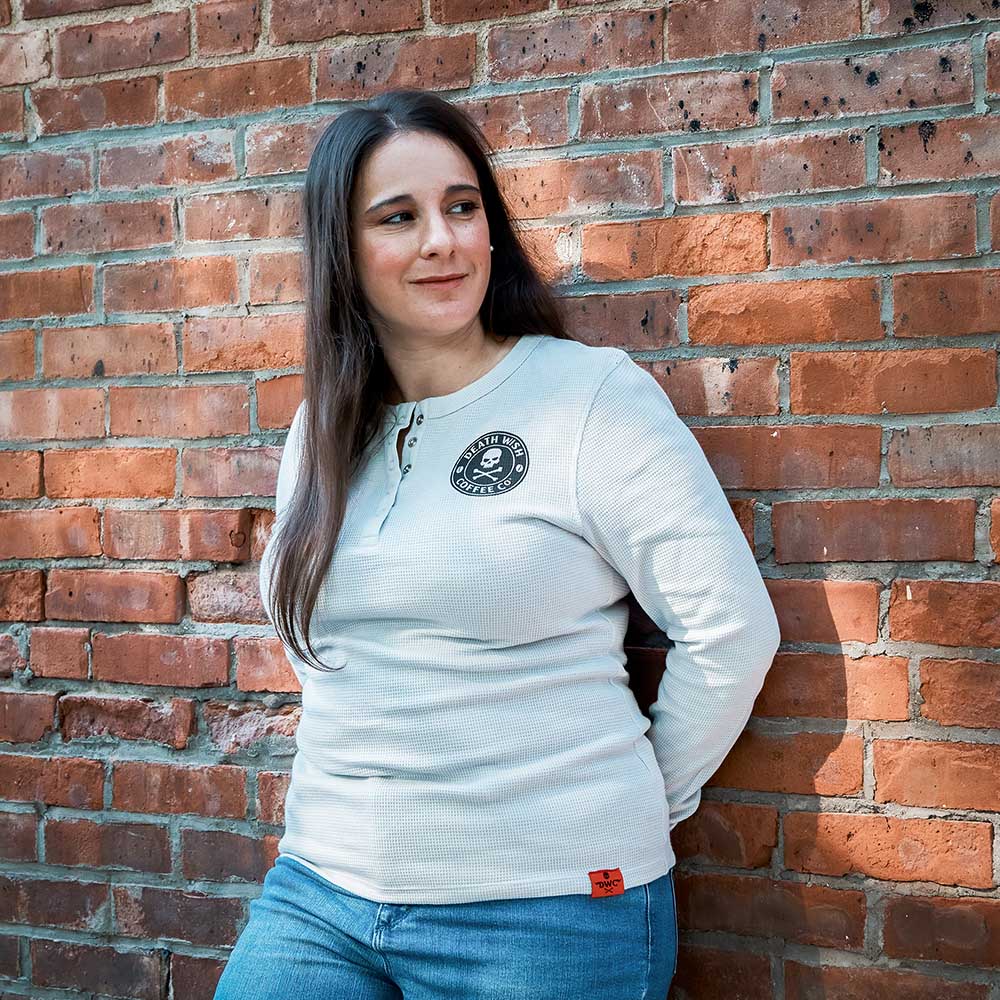 A model wearing the Death Wish Coffee Rolling Bones Women's Waffle Knit.