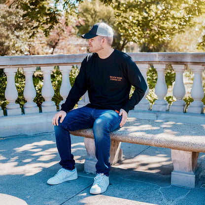 A model wearing the Death Wish Coffee Nothing to Hide Pocket Tee.