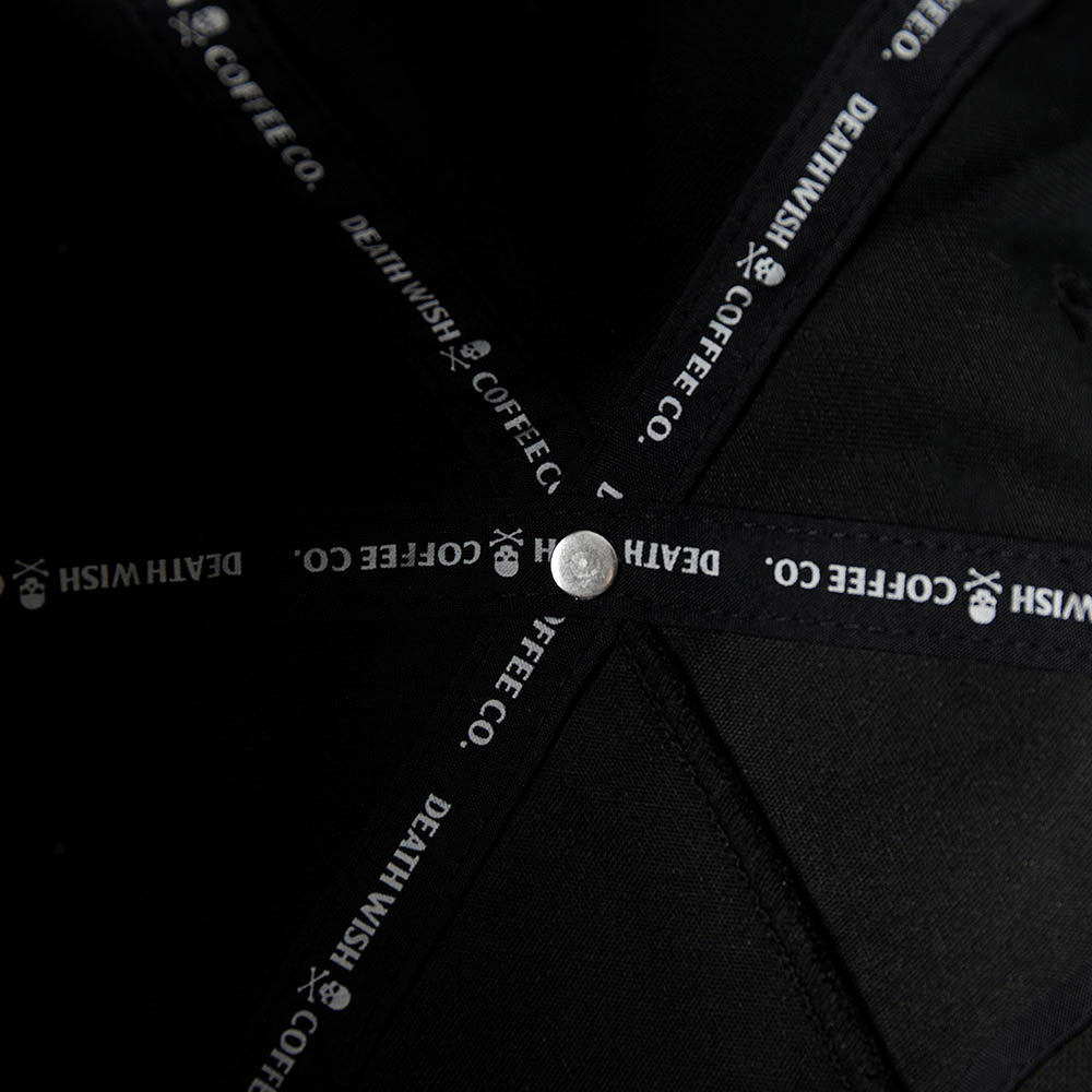 The custom interior taping of the Death Wish Coffee Black Rebellious By Nature Snapback.