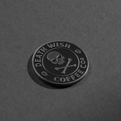 A side angle view of the Death Wish Coffee Heads or Horses’ Tails Commemorative Coin.
