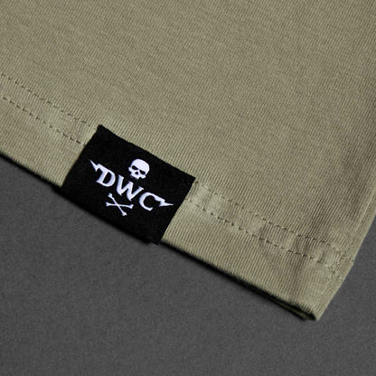 The woven hem label of the Death Wish Coffee Dropout Collegiate Tee.