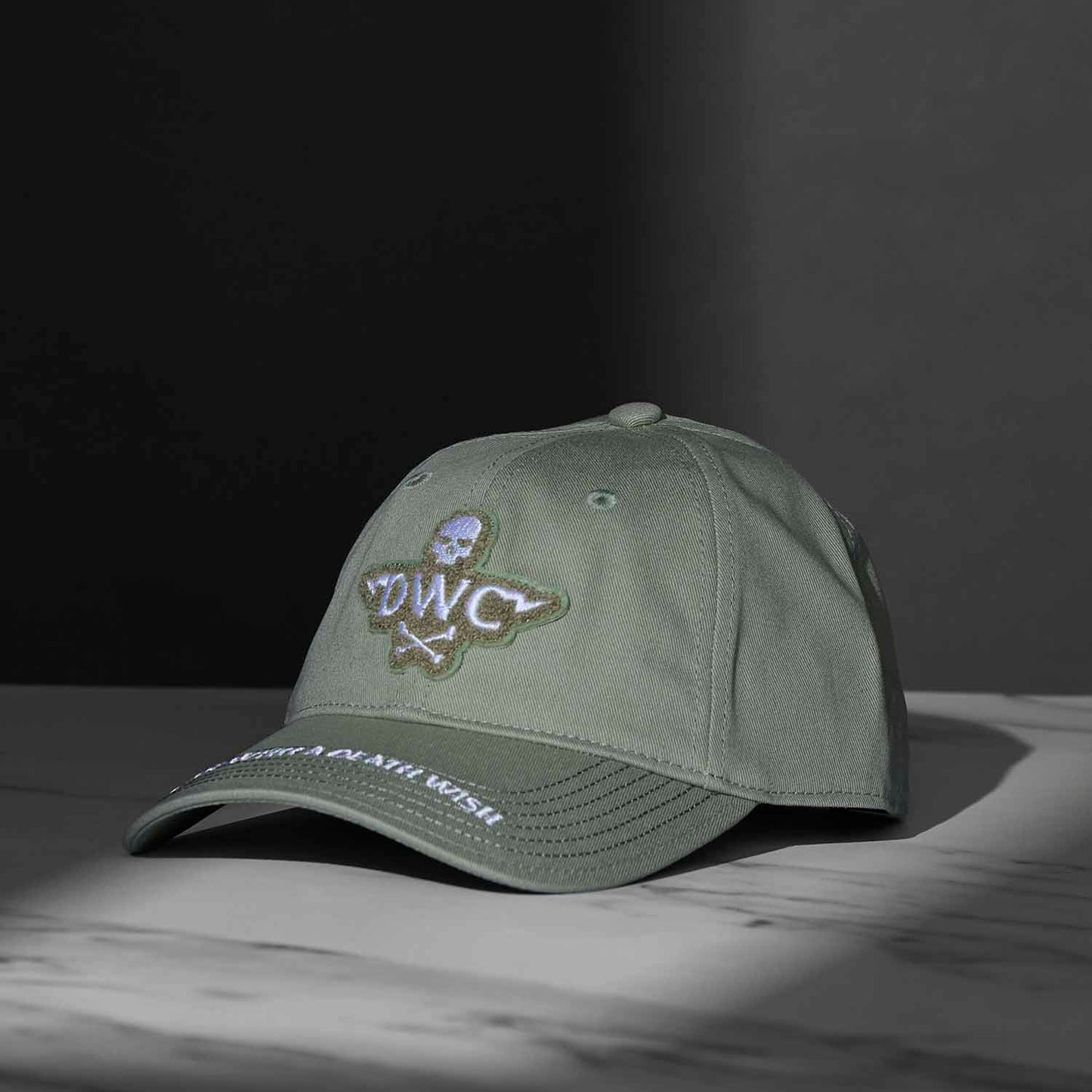 A side angle view of the Death Wish Coffee Thick Skull Snapback.