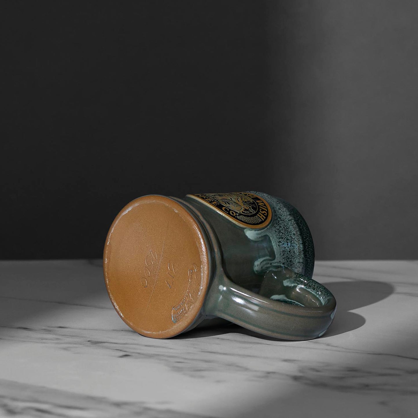 The bottom stamp of the Death Wish Coffee Cursed Waters Kelpie Tankard.