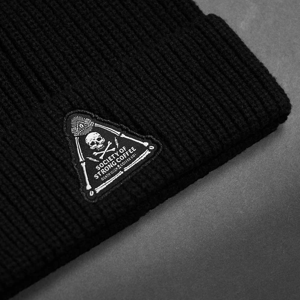 A close up of the front of the Death Wish Coffee Society Insignia Beanie.