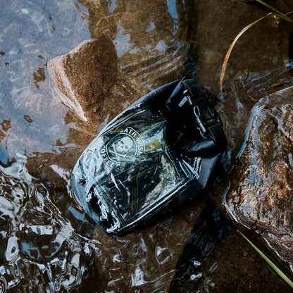 The Death Wish Coffee Rock The Boat Waterproof Bag submerged in water.