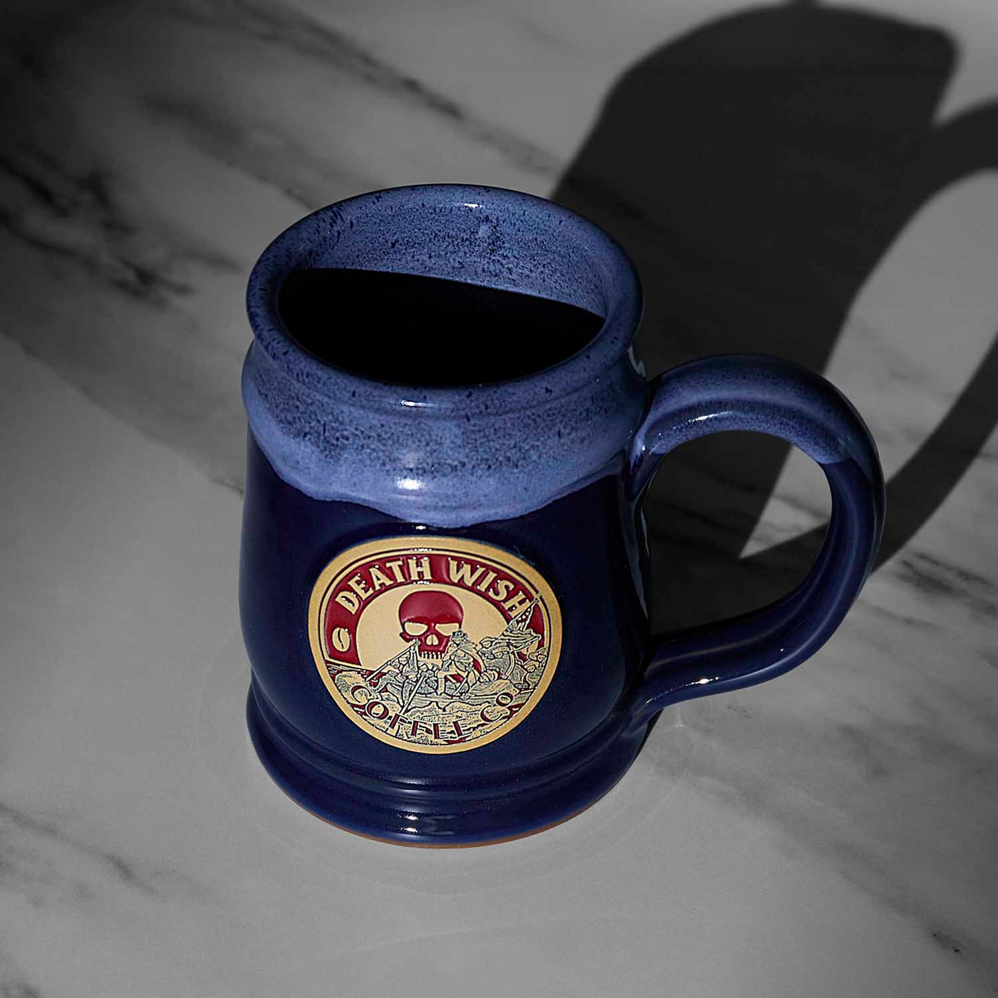 A top down view of the blue Death Wish Coffee Declaration of Caffeination Mystery Mug.