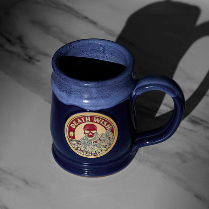A top down view of the blue Death Wish Coffee Declaration of Caffeination Mystery Mug.
