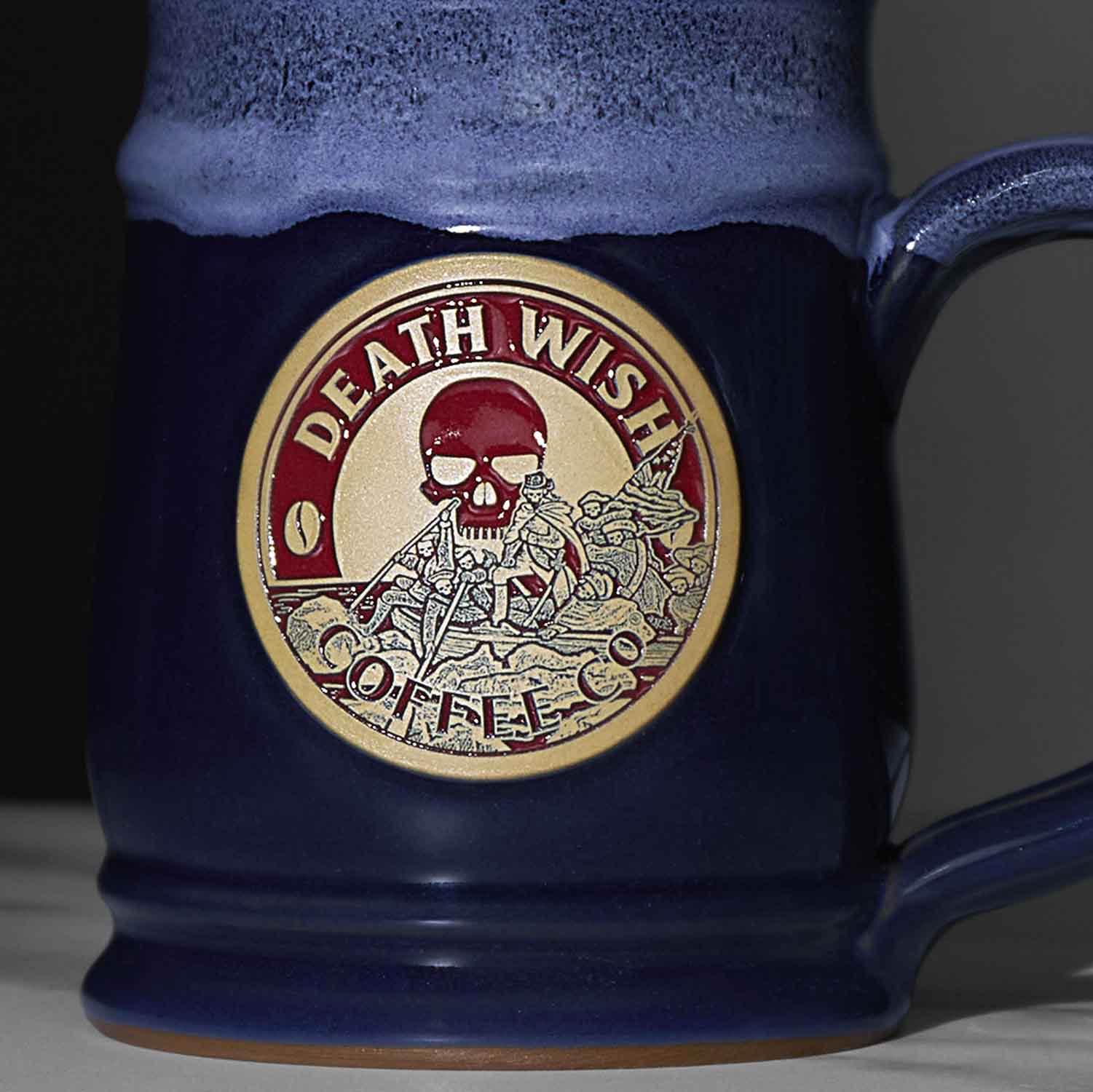 A close up of the blue Death Wish Coffee Declaration of Caffeination Mystery Mug.