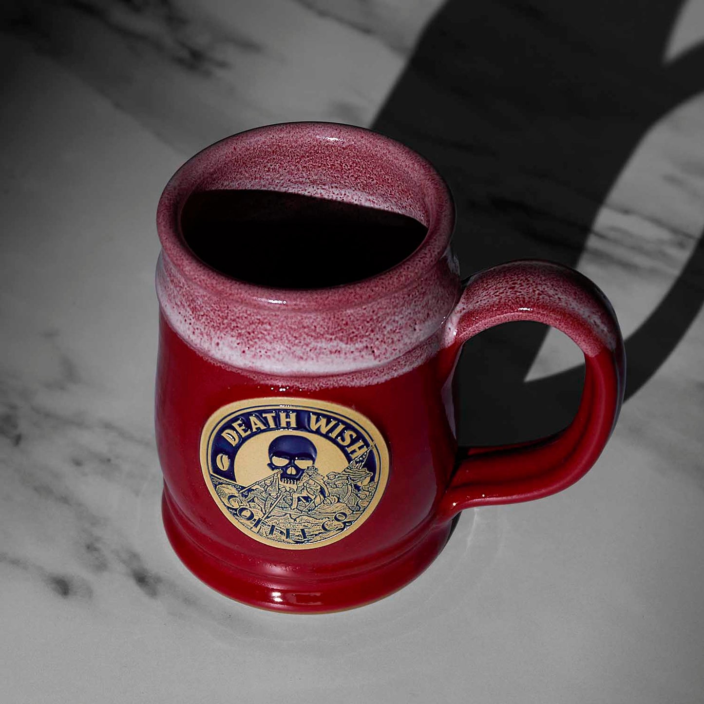 A top down view of the red Death Wish Coffee Declaration of Caffeination Mystery Mug.