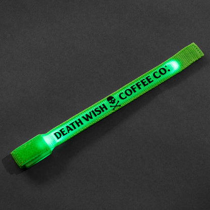 The Death Wish Coffee Midnight Marker Arm Band with the lights turned on.