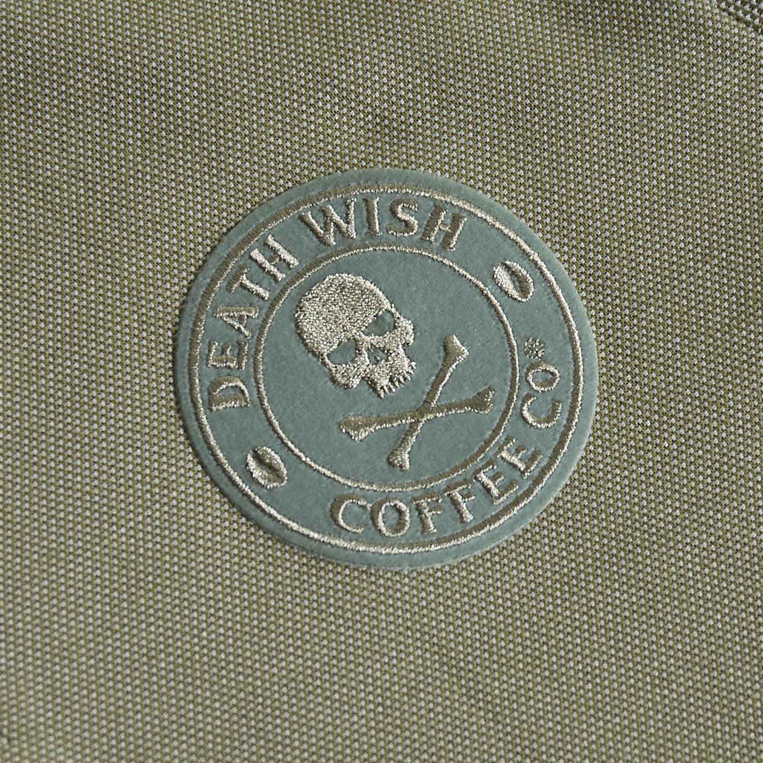 A detail shot of the front of the Death Wish Coffee Par For The Course Polo.