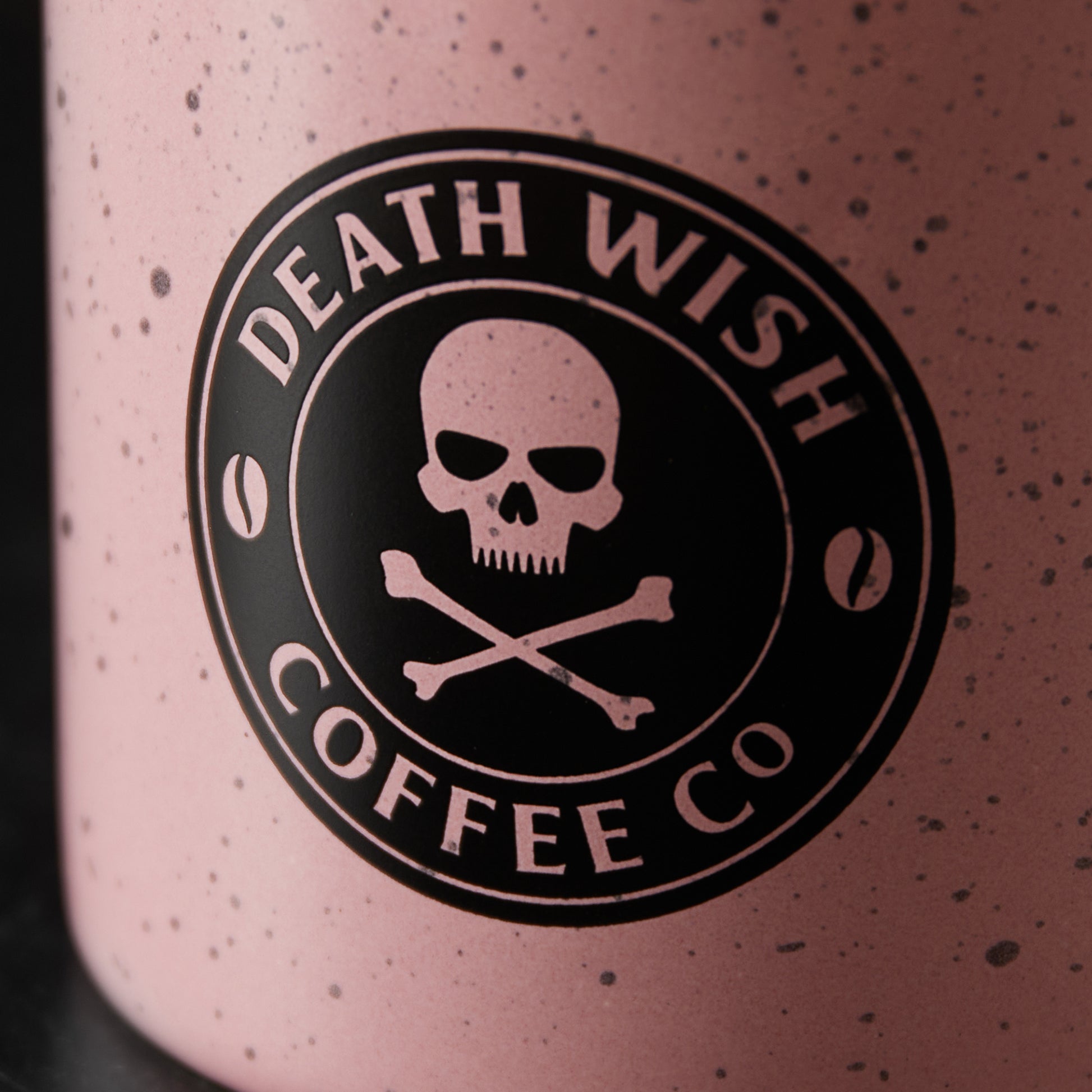 A close up of the front of the Death Wish Coffee Pink Camper Mug.