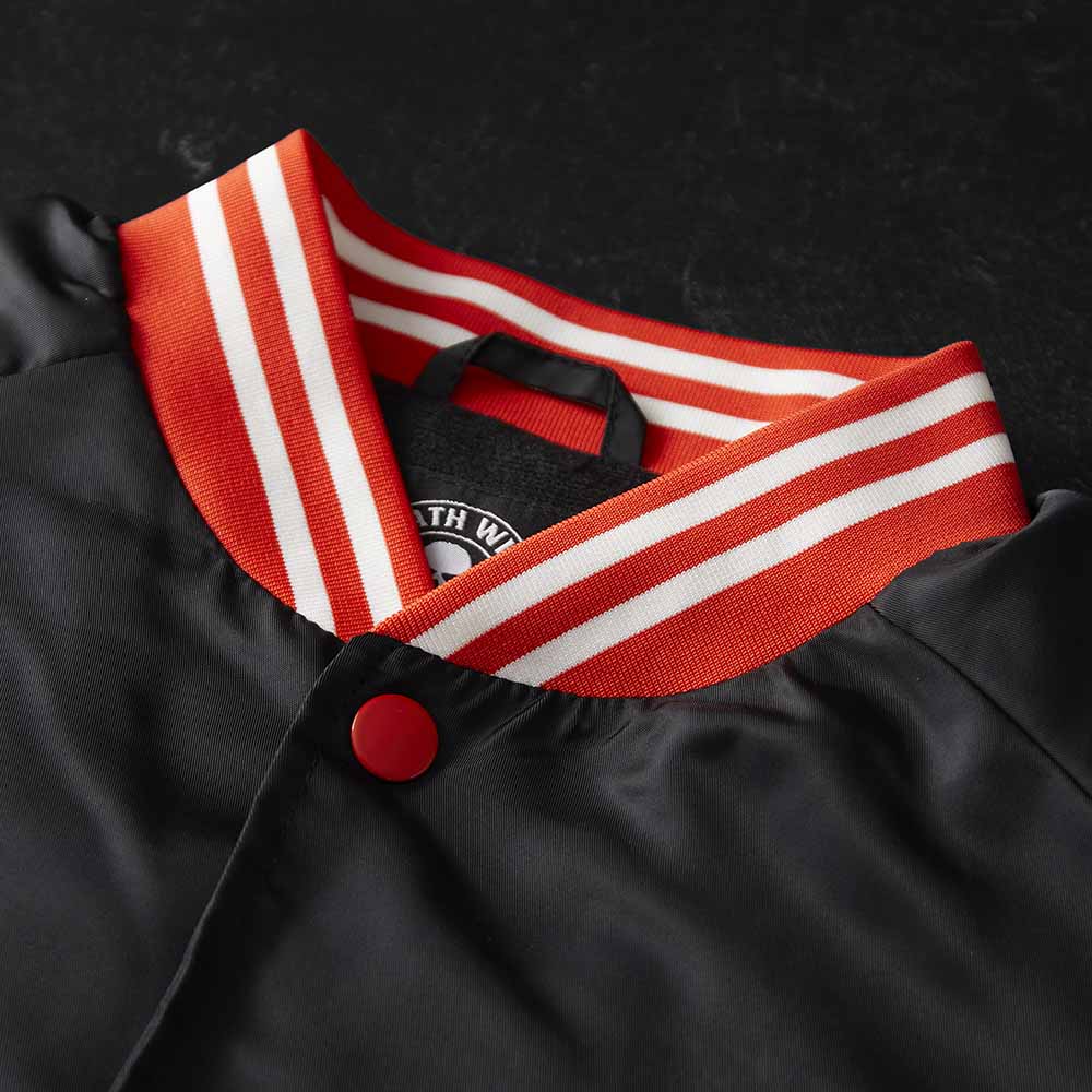 The neck detail of the Death Wish Coffee Level Up Letterman Jacket.