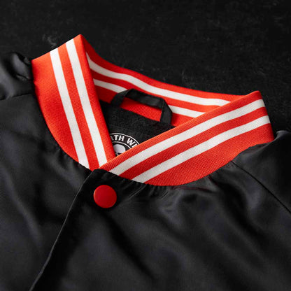 The neck detail of the Death Wish Coffee Level Up Letterman Jacket.
