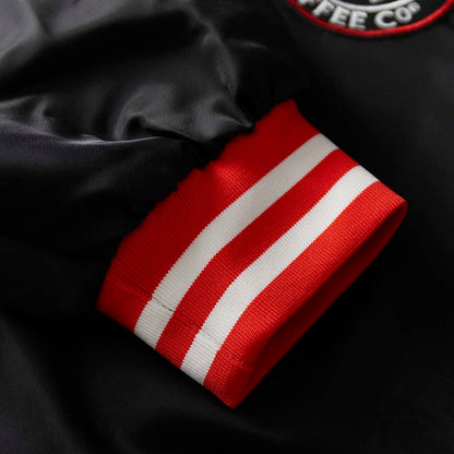 The cuff details of the Death Wish Coffee Level Up Letterman Jacket.