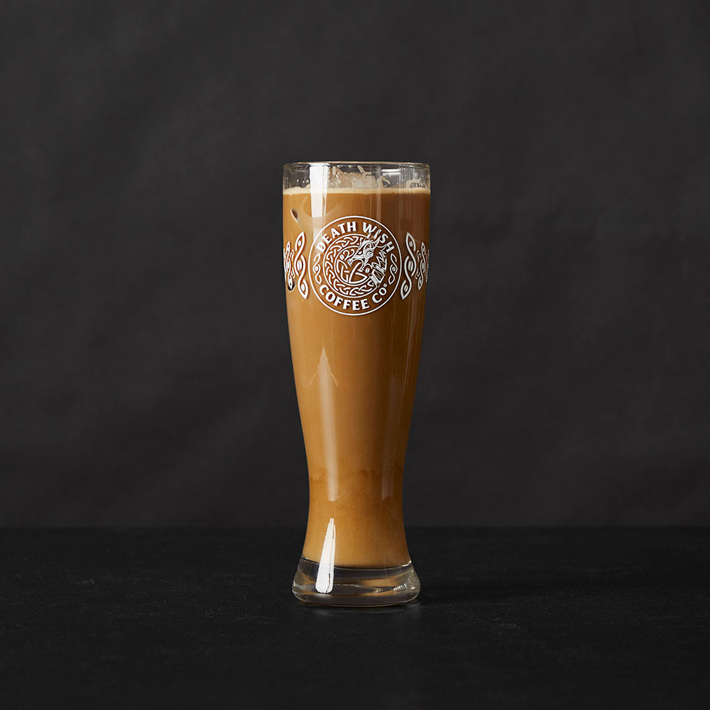 The Death Wish Coffee Dragon's Dawn Pint Glass Set filled with coffee.
