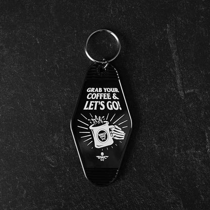 The front of the Death Wish Coffee Coffee, Road Trip, Repeat Keychain.