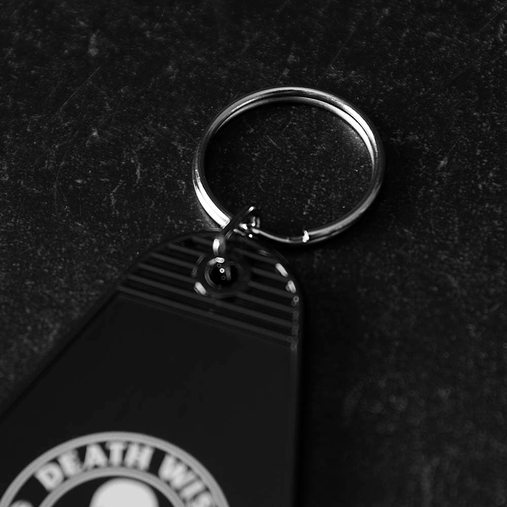A detail shot of the Death Wish Coffee Coffee, Road Trip, Repeat Keychain.