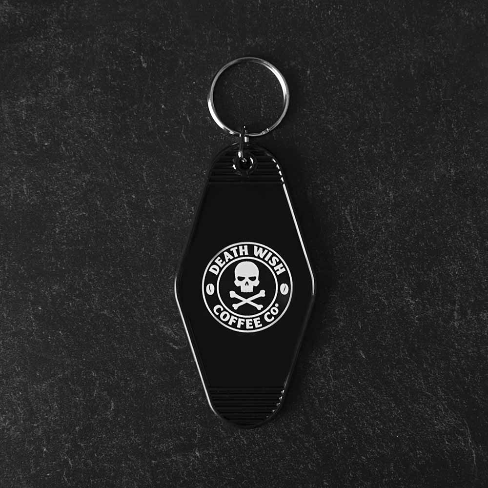 The back of the Death Wish Coffee Coffee, Road Trip, Repeat Keychain.