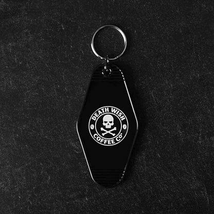 The back of the Death Wish Coffee Coffee, Road Trip, Repeat Keychain.