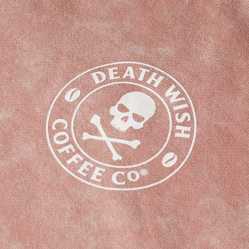 A close up of the front of the Death Wish Coffee Pink Haze Cropped Half Zip.