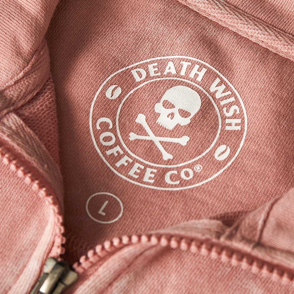 The inner neck label of the Death Wish Coffee Pink Haze Cropped Half Zip.