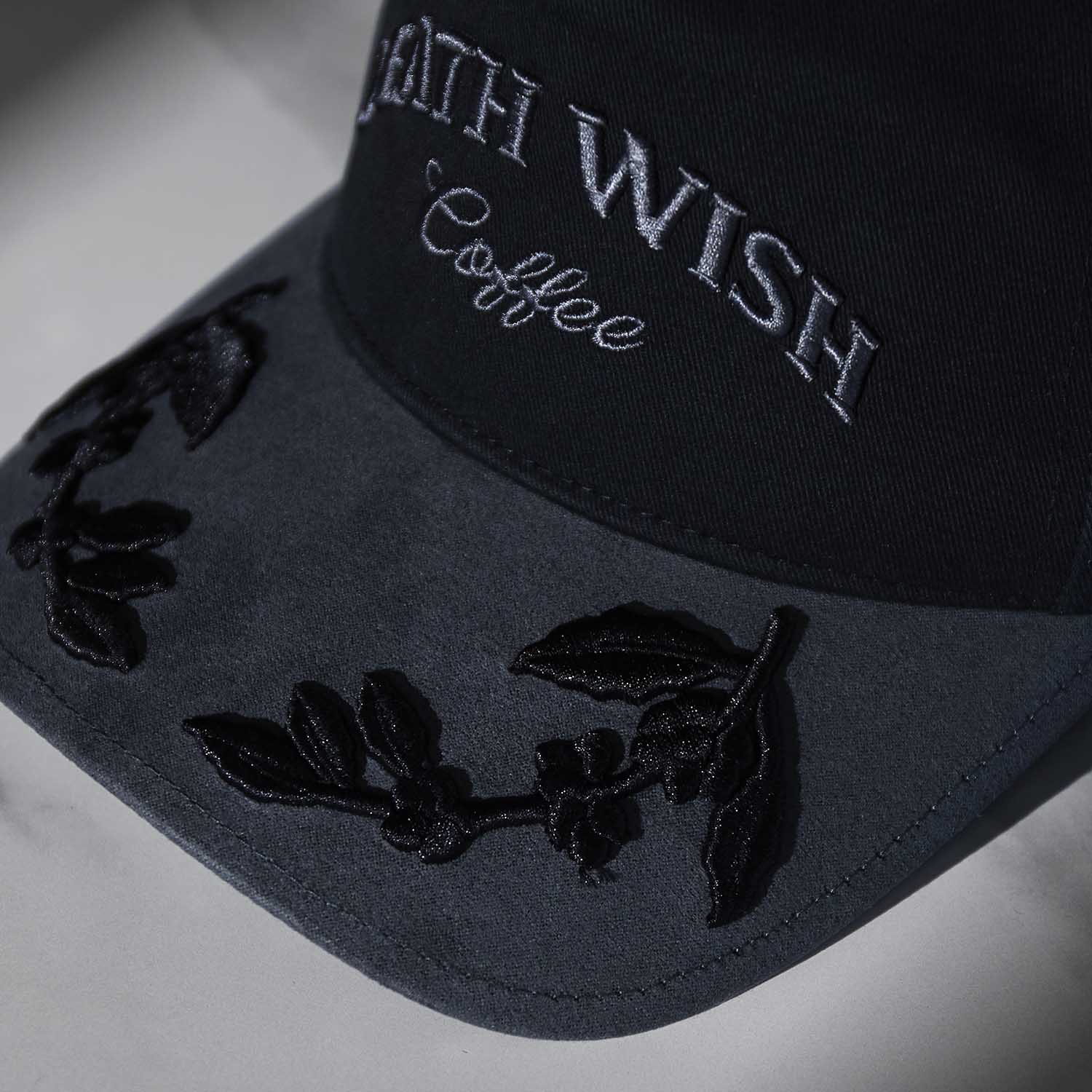 The visor embroidery detail of the Death Wish Coffee Graveyard Shift Snapback.