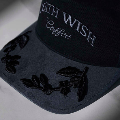 The visor embroidery detail of the Death Wish Coffee Graveyard Shift Snapback.