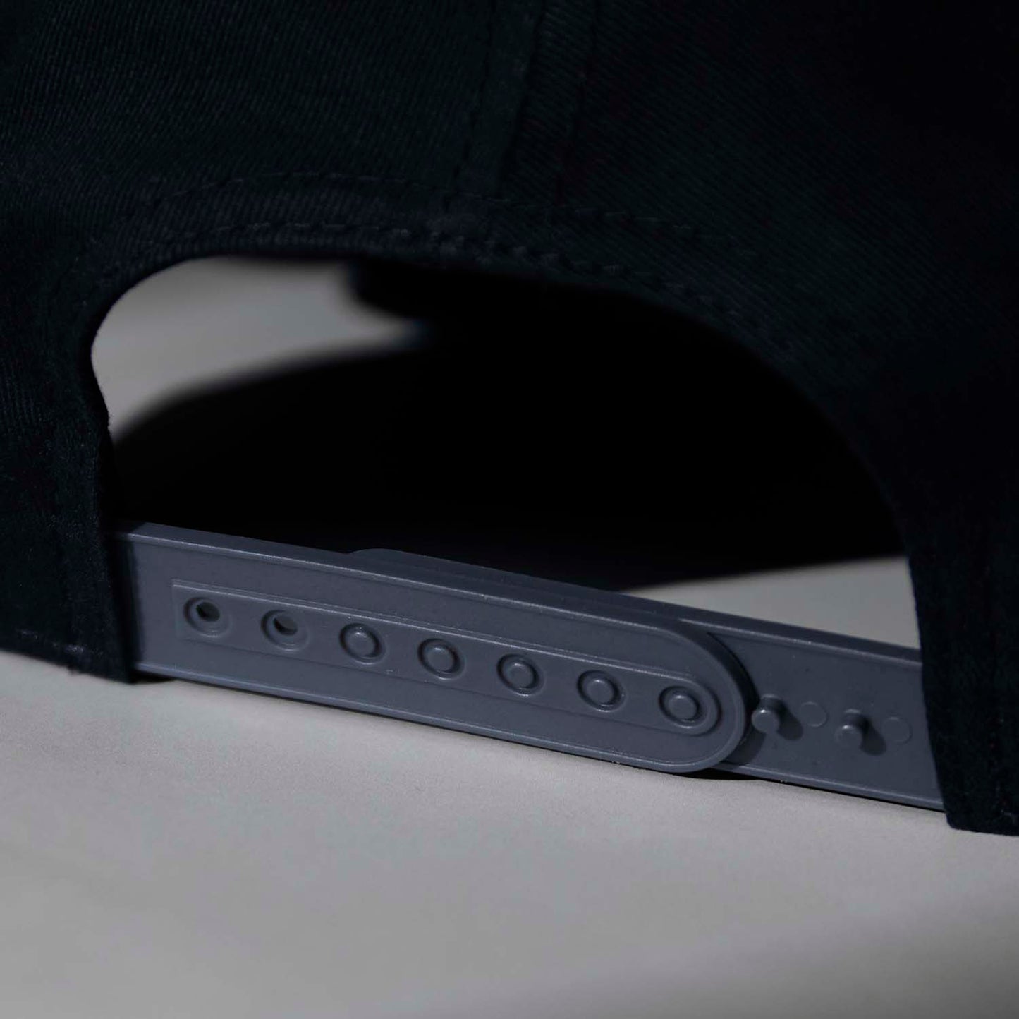 The adjustable snapback closure of the Death Wish Coffee Graveyard Shift Snapback.