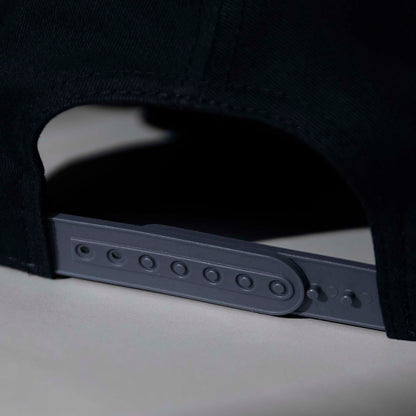 The adjustable snapback closure of the Death Wish Coffee Graveyard Shift Snapback.