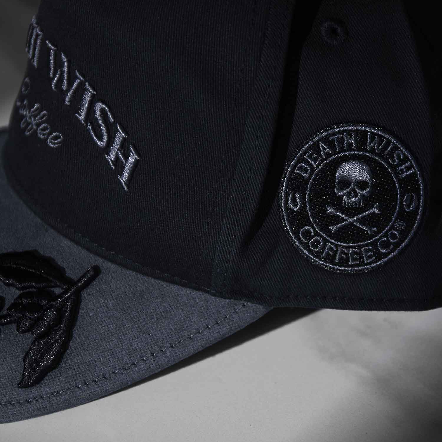 The side logo of the Death Wish Coffee Graveyard Shift Snapback.