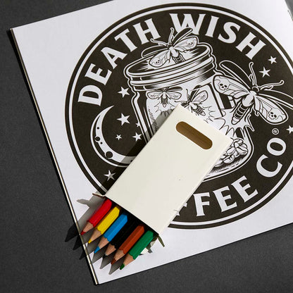 The Death Wish Coffee Medallion Meditations Coloring Book with colored pencils.