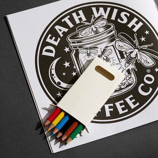 The Death Wish Coffee Medallion Meditations Coloring Book with colored pencils.