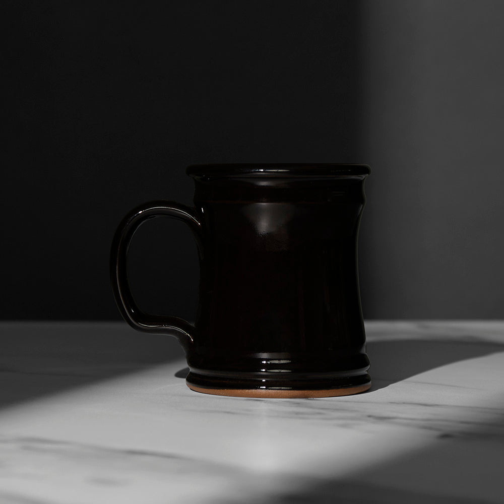 The back of the black Death Wish Coffee Naughty or Nice Mug.