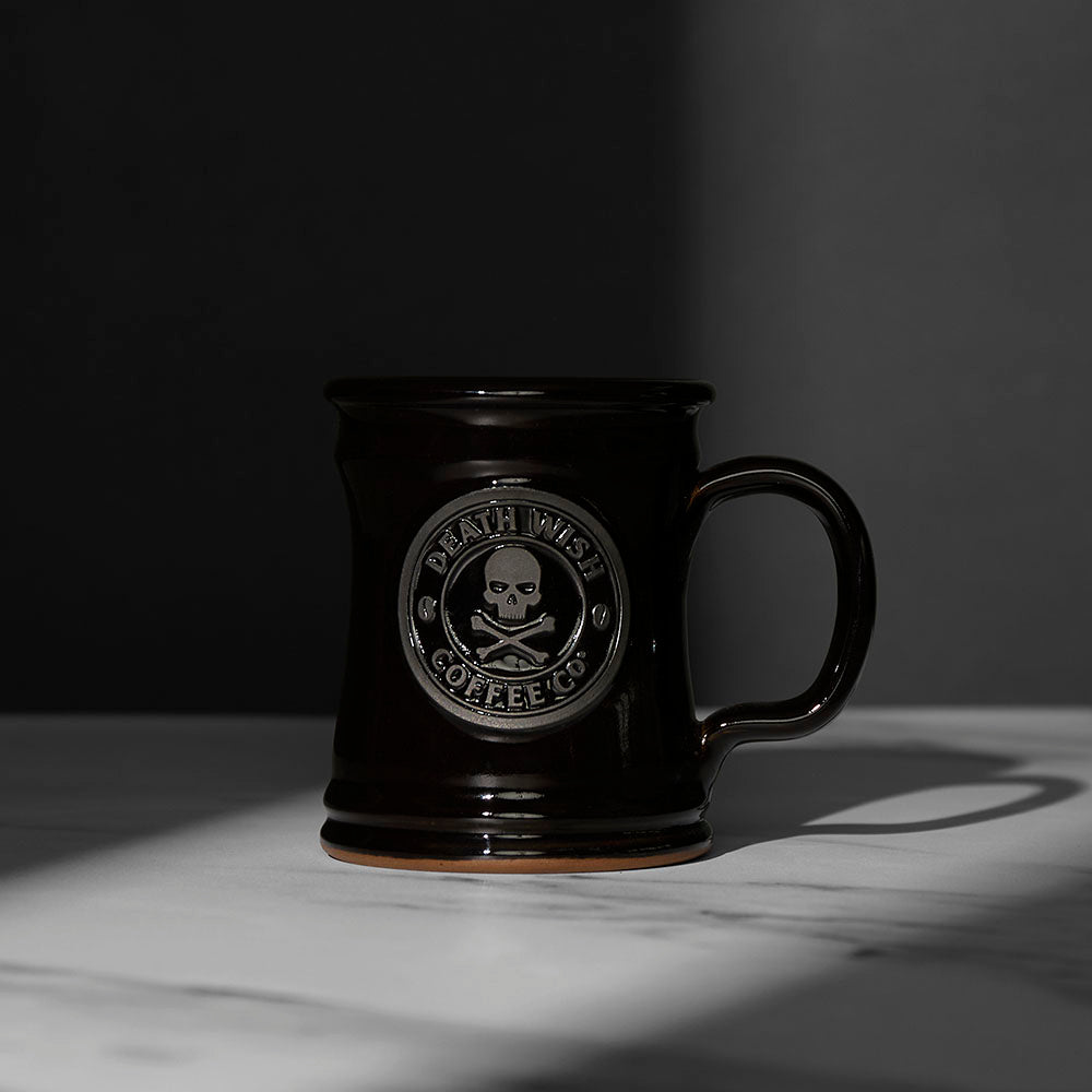 The front of the black Death Wish Coffee Naughty or Nice Mug.
