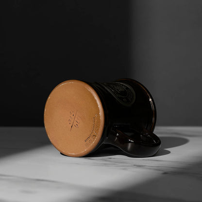 The bottom of the black Death Wish Coffee Naughty or Nice Mug.