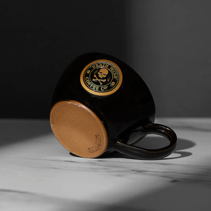 The bottom of the Black Death Wish Coffee Double or Nothing Ceramic Espresso Mug.