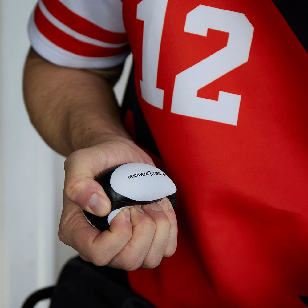 Squeezing the Death Wish Coffee Death Grip Stress Ball.