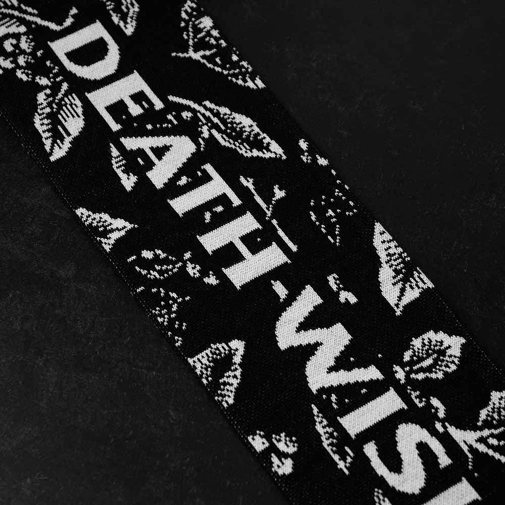 A close up of the Death Wish Coffee Sacred Bloom Knit Scarf.