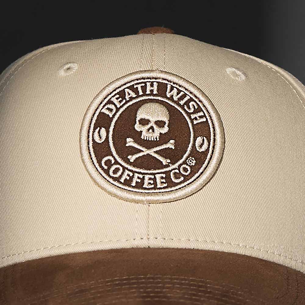 A close up of the front of the Death Wish Coffee Cream and Coffee Snapback.