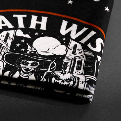 A close up of the Death Wish Coffee Trick or Treat Tea Towel Set.