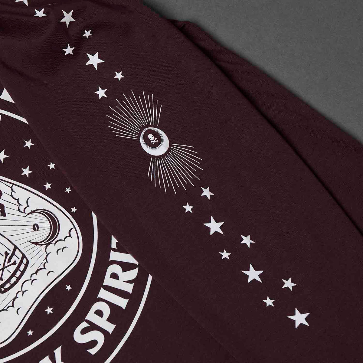 A close up of the sleeve of the Death Wish Coffee Dark Spirits Long Sleeve.