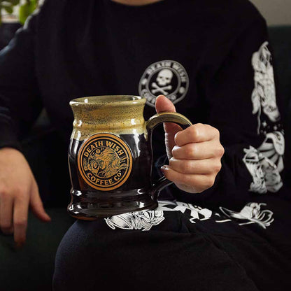 A model holding the Death Wish Coffee Two Faced Tankard.