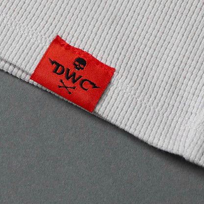 The woven label on the Death Wish Coffee Rolling Bones Women's Waffle Knit.