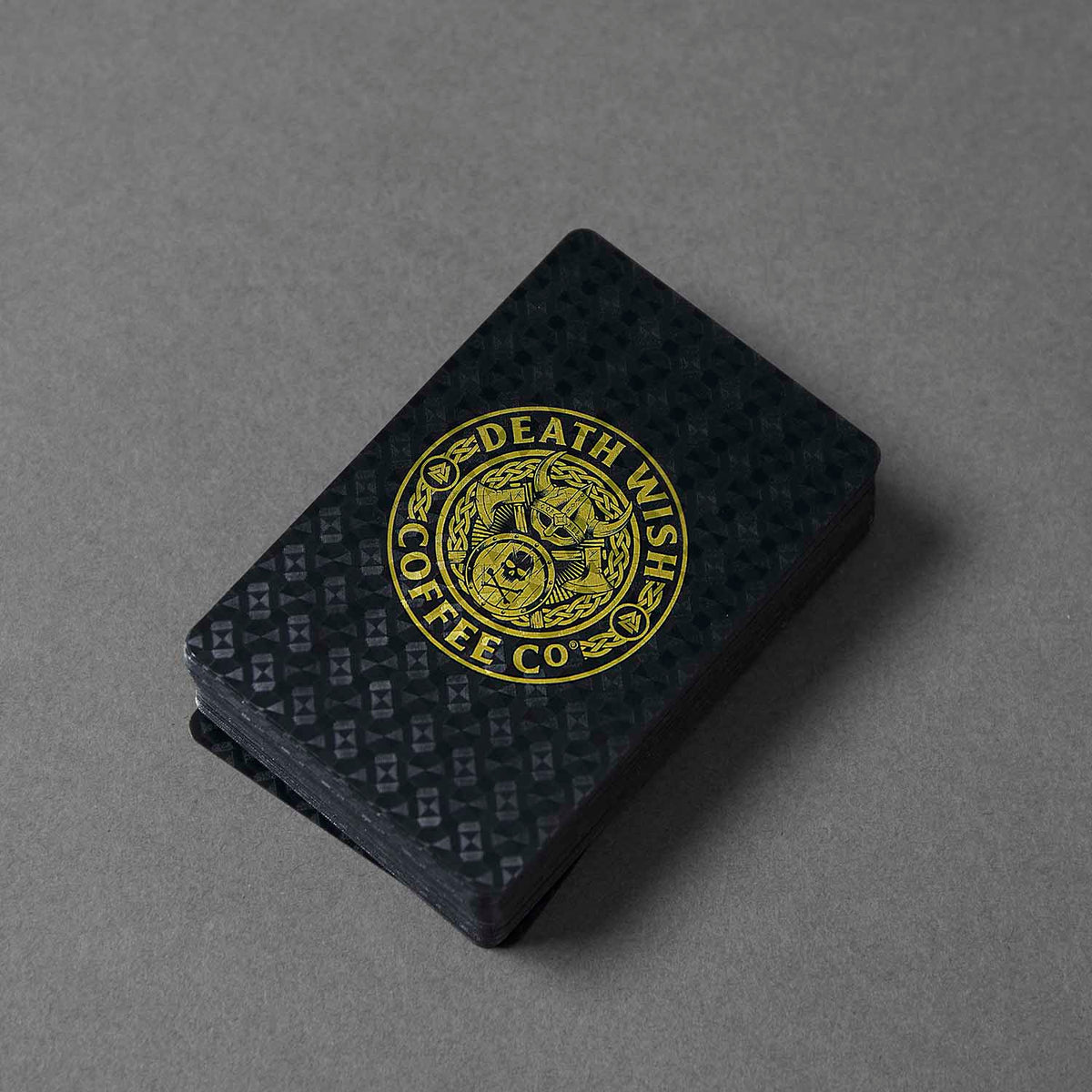 A stack of the Death Wish Coffee Odin's Deck of Destiny Playing Cards.