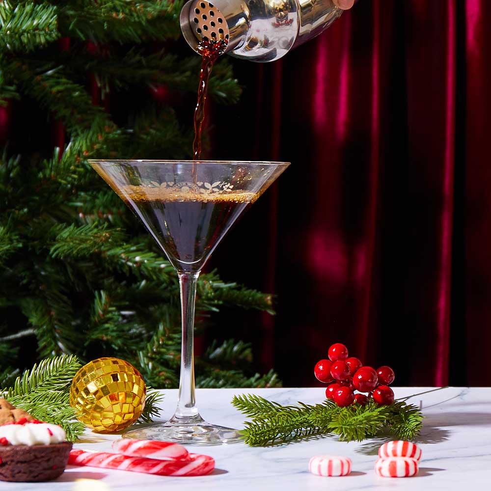 Pouring a drink into the Death Wish Coffee Martini Glass.