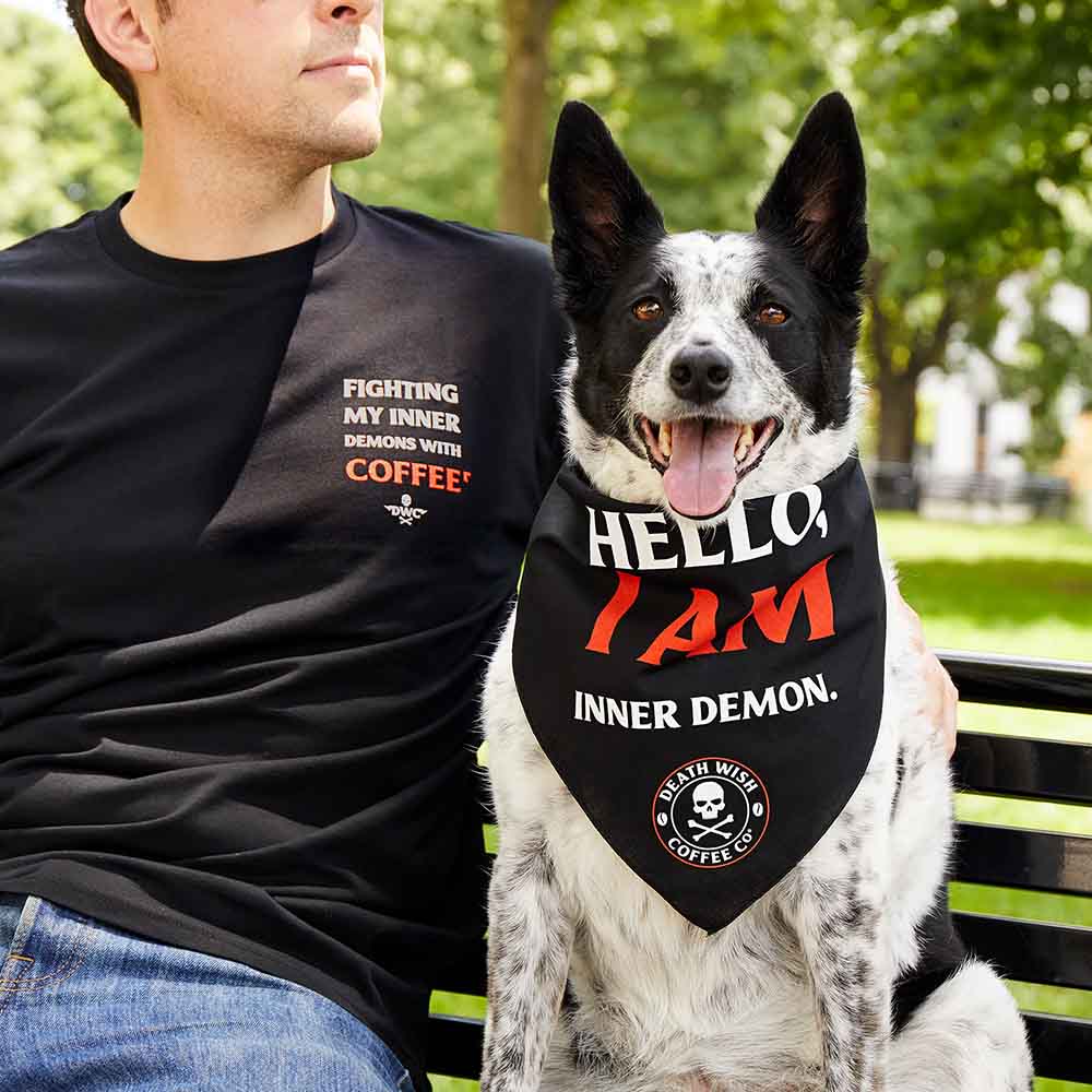 A man and his dog in the Death Wish Coffee Inner Demon Tee and Bandana Bundle.