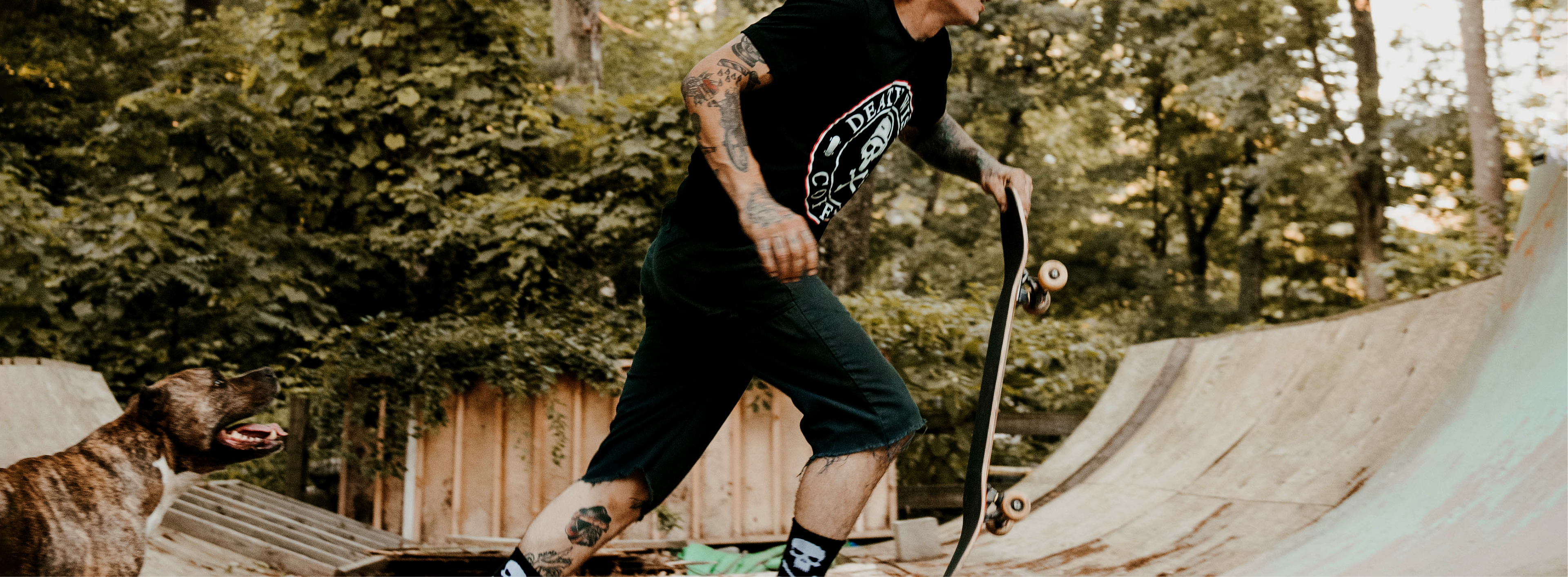 Skateboarding in a Death Wish Coffee Tee